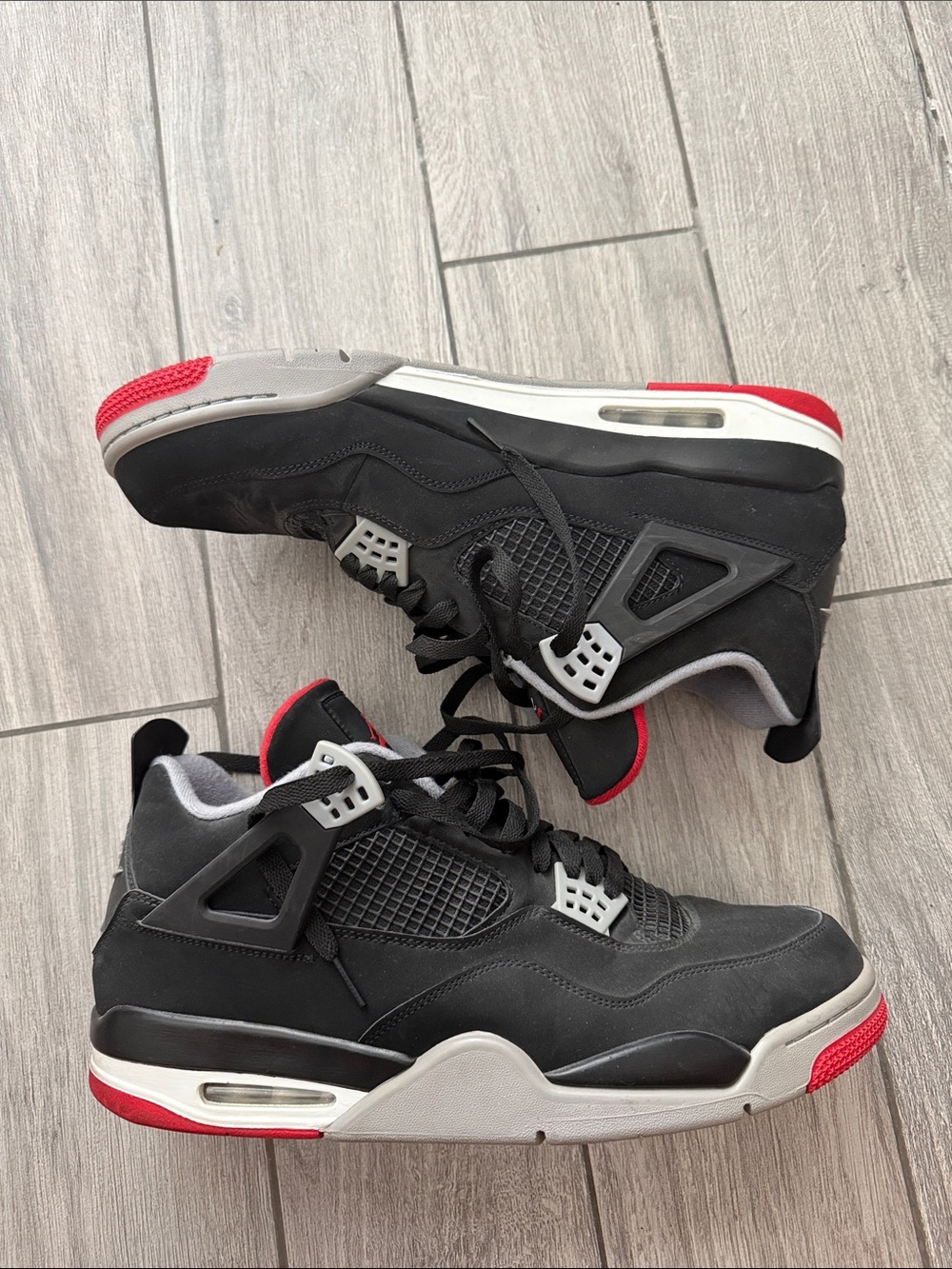 Jordan Men's Black and Red Retro Basketball Sneakers. Jordan 4 Bred